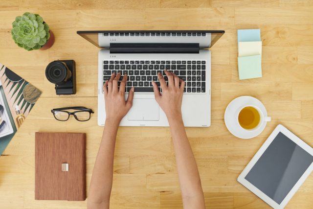 Woman working on laptop at office